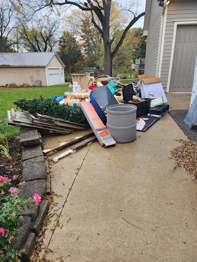 Dumpster being loaded with debris for Roofing Dumpster Rental in Westbrook